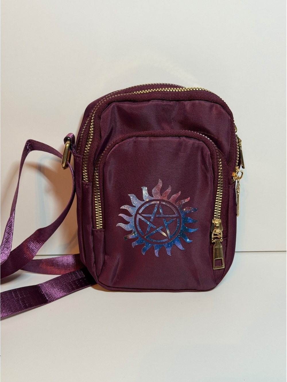 Maroon small crossbody bag with anti possession symbol from Supernatural. New